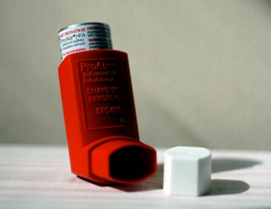 asthma inhaler on table